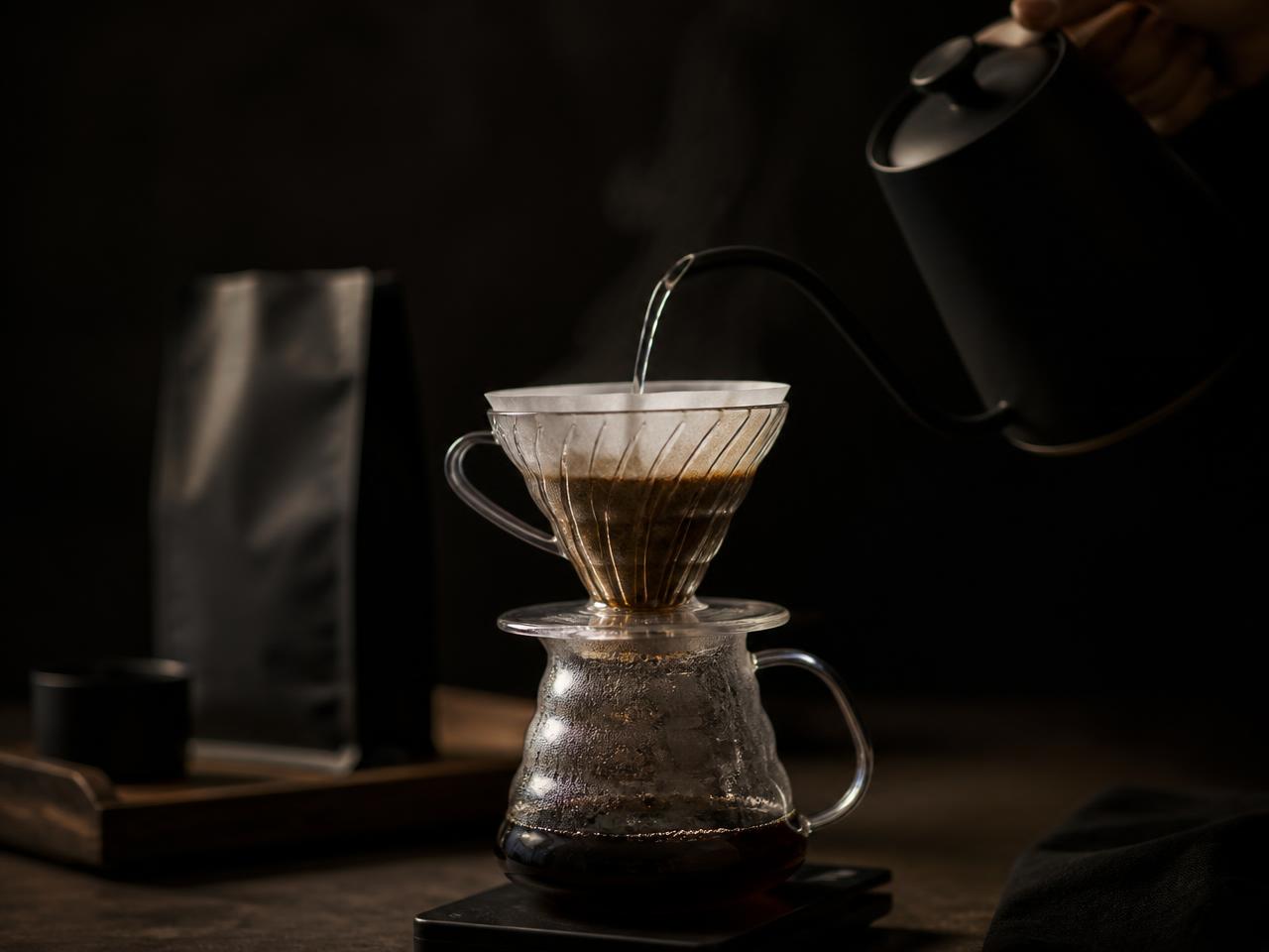 Pour-over coffee being brewed with a gooseneck kettle